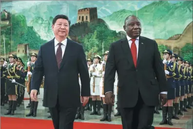  ?? FENG YONGBIN / CHINA DAILY ?? President Xi Jinping accompanie­s South African President Cyril Ramaphosa in the Great Hall of the People in Beijing on Sunday.