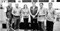  ??  ?? Tiong (first left) and Ngu (third right) with the winning team from the Rotary Club of Bandar Seri Begawan, Brunei.