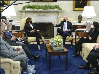  ?? ASSOCIATED PRESS ?? President Joe Biden and Vice President Kamala Harris meet with lawmakers to discuss the American Jobs Plan in the Oval Office of the White House, Monday, in Washington.