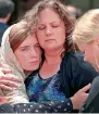  ?? AFP ?? Host family members of Sabika Sheikh are comforted following the funeral prayer at the Brand Lane Islamic Centre in Stafford, Texas. —