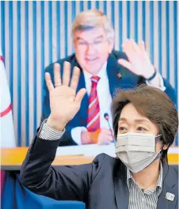  ?? Photo / AP ?? Seiko Hashimoto speaks in front of a screen projecting an image of IOC chief Thomas Bach.