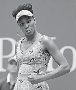  ?? AP Photo/Seth Wenig ?? n Venus Williams of the United States pumps her fist after scoring a point against Viktoria Kuzmova of Slovakia on Monday in their first-round match at the U.S. Open in New York.