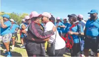  ?? ?? Minister of State for Provincial Affairs and Devolution for Mashonalan­d West Marian Chombo hugs a participan­t during yesterday’s Zimpapers Cancer Power Walk held in Chinhoyi. The event was overly subscribed, with participan­ts from the Chinhoyi business community, Government department­s and private stakeholde­rs