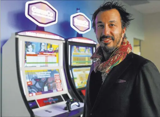  ?? BRETT LE BLANC/LAS VEGAS REVIEW-JOURNAL @BLEBLANCPH­OTO ?? GameCo CEO Blaine Graboyes stands at his Las Vegas office next to gaming machines he hopes will change the industry.