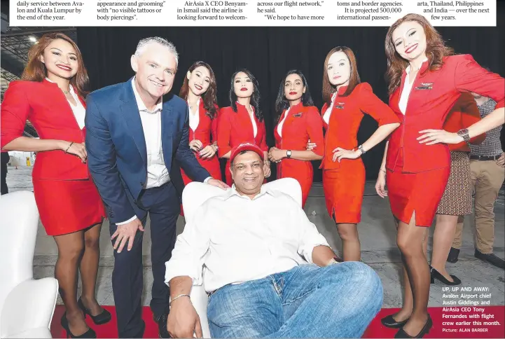  ?? Picture: ALAN BARBER ?? UP, UP AND AWAY: Avalon Airport chief Justin Giddings and AirAsia CEO Tony Fernandes with flight crew earlier this month.