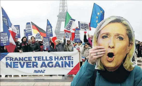  ?? PASCAL ROSSIGNOL / REUTERS ?? Una mujer con una máscara de Marine Le Pen en una manifestac­ión ayer en París con el cartel “Francia le dice al odio: ¡nunca más!”