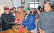  ?? PTI ?? Himachal BJP chief Rajeev Bindal greets party candidate Indu Goswami (centre) as chief minister Jai Ram Thakur (right) looks on in Shimla on Friday.