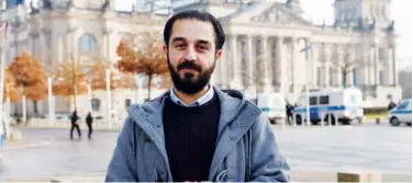  ?? Reuters ?? ↑
Syrian migrant Tareq Alaows, who is running for the Greens party in German elections, speaks to the media in Bundestag on Thursday.