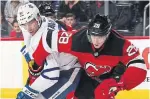  ?? BRUCE BENNETT GETTY IMAGES ?? John Tavares of the Maple Leafs battles for the puck with Damon Severson of the New Jersey Devils during the first period.