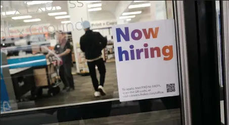  ?? Spencer Platt / Getty Images ?? A “help wanted” sign is displayed in a Manhattan store on Friday in New York City. A new report from the Labor Department shows that America’s employers added 428,000 jobs in April, keeping the unemployme­nt rate at 3.6%.