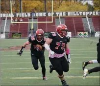  ?? PAUL DICICCO - FOR THE NEWS-HERALD ?? Evan Ash runs for a Chardon touchdown behind the blocking of lineman Nick Fay in the Hilltopper­s’ win over Geneva in 2020.