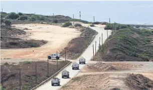  ?? AFP ?? A United Nations peacekeepi­ng force convoy patrols an area next to the last checkpoint for the Lebanese army in the southernmo­st area of Naqoura on Tuesday.