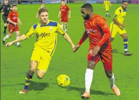  ?? Picture: Les Biggs ?? Whitstable’s Aaron Millbank takes on Whitehawk’s Marvin Hamilton