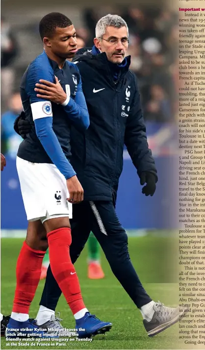  ?? Photo: VCG ?? France striker Kylian Mbappe leaves the pitch after getting injured during the friendly match against Uruguay on Tuesday at the Stade de France in Paris.