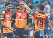  ??  ?? Sunrisers Hyderabad cricketers Sandeep Sharma (L), Shikhar Dhawan (C) and Shakib Al Hasan celebrate after the wicket of unseen Mumbai Indians batsman Evin Lewis during their IPL match at The Wankhede Stadium in Mumbai on Tuesday.