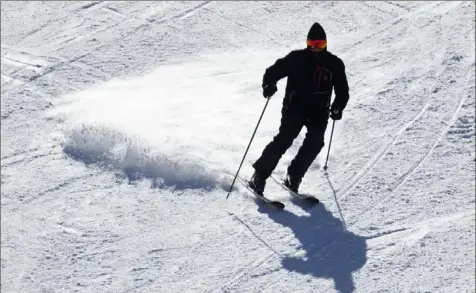  ?? Pam Panchak/Post-Gazette ?? A skier speeds down the slope at Seven Springs Mountain Resort on Friday in Champion.