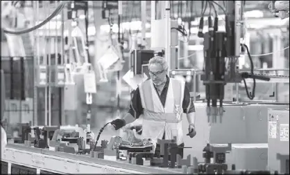  ?? REUTERS ?? A Volvo employee works in the final assembly building at the first US production plant in Ridgeville, South Carolina, US.