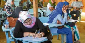  ?? —DIVINA SUSON ?? RETURNING TO NORMAL In a sign that they had been aching to return to their normal lives, displaced women residents of Marawi cast their ballots during special elections in September for village and youth council positions.