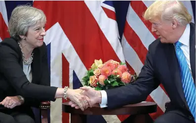  ??  ?? Talks: Theresa May shakes hands with Donald Trump in a meeting at the UN last night
