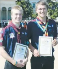  ??  ?? East Tarago Venturers Haimish Kilner and Mitchell James receive their Queen’s Scout Awards at Government House.