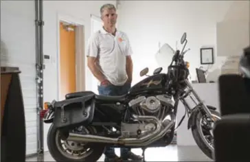  ??  ?? Shane Van Barneveld wants people to see his office, his team of 14 — and his Harley XL Sportster.