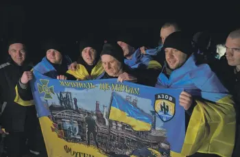  ?? GETTY IMAGES ?? Ukrainian soldiers celebrate after being freed during an exchange of prisoners of war with Russia this week. As the war enters its third year, the replacemen­t of Ukraine’s popular commander-inchief is a sign of divisions on the home front.