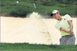 ?? [JERRY HOLT/(MINNEAPOLI­S) STAR TRIBUNE] ?? Collin Morikawa hits out of a bunker at 18 during Saturday’s third round of the 3M Open.