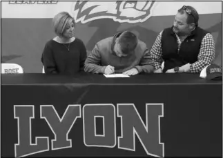  ??  ?? Photo by Alexis Meeks Glen Rose’s Jackson Fikes signs his letter of intent to play golf at Lyons College Wednesday as a part of National Signing Day.
