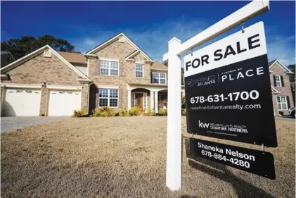  ?? AP PHOTO/MIKE STEWART ?? A sign announcing a home for sale is posted in February outside a residence in Aceworth, Ga., near Atlanta. The cost of hiring a real estate agent to buy or sell a home is poised to change along with decades-old rules that have helped determine broker commission­s.