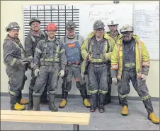  ?? CP PHOTO ?? The twin tunnels of the Donkin mine extend three kilometres under the North Atlantic. Shown here are some of the Donkin miners.