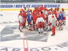  ?? PHOTO BY DAVID SAMSON /THE FORUM ?? ALL TOGETHER: Boston University hits the ice for practice yesterday in Fargo, N.D.