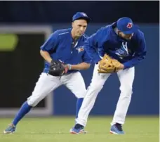  ?? DARREN CALABRESE/THE CANADIAN PRESS ?? Second baseman Ryan Goins, left, says shadowing double-play partner Troy Tulowitzki has improved his understand­ing of the game.