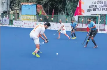  ?? HT PHOTO ?? ■ Punjab and Karnataka men in action on the opening day of the 5-a-side senior nationals at Kanpur on Sunday.