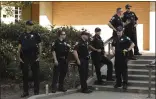  ?? CARIN DORGHALLI — ENTERPRISE-RECORD FILE ?? Chico police officers stand by June 8during a peaceful protest in front of the City Council Chambers in Chico.