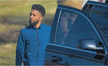  ?? KARL MERTON FERRON/STAFF ?? Baltimore Mayor Brandon Scott returns to his vehicle after being briefed on a fatal shooting just west of Patterson High School on March 6, 2023.