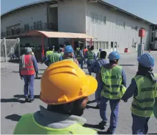  ?? Christophe­r Pike / The National ?? Labourers at the Saadiyat Accommodat­ion Village. Head teachers suggested children should visit such camps