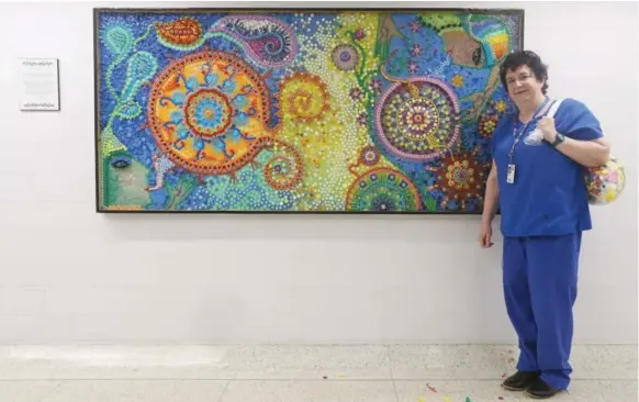  ?? STEVE RUSSELL PHOTOS/TORONTO STAR ?? Nurse Tilda Shalof collected medicine caps and lids, IV tubes and syringe covers. With the help of artist Vanessa Herman, she turned them into a massive mural, using 10,000 pieces.