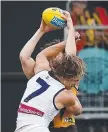  ??  ?? Nat Fyfe hits Taylor Duryea.