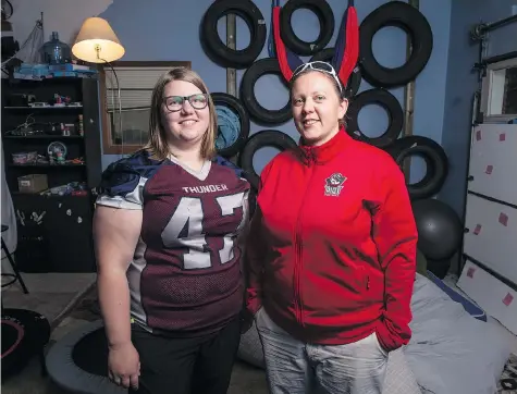  ?? BRANDON HARDER ?? Amery Deren, left, a running back for the Regina Riot and her wife, Bre Deren, equipment manager for the Riot, have been inspired by the outpouring of support after their van was stolen Sunday with the Riot’s jerseys inside. The Regina Thunder team even lent the Riot their jerseys.