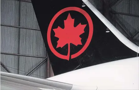  ?? MARK BLINCH THE CANADIAN PRESS ?? Air Canada and Transat have a combined 60 per cent slice of the transatlan­tic market from Canada. Air Canada is offering $520 million for Transat.