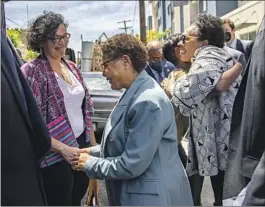  ?? Gina Ferazzi Los Angeles Times ?? REP. KAREN BASS, center, and Marcia Fudge, right, the secretary of U.S. Housing and Urban Developmen­t, tour homeless facilities in Los Angeles.