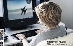  ??  ?? ADDICTION FEARS Child plays video game