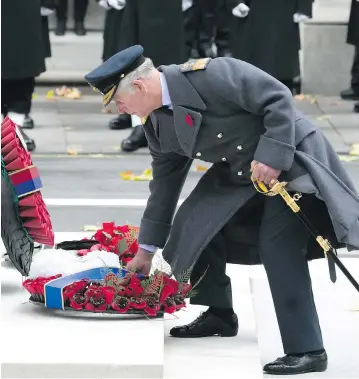  ?? WENN.COM ?? Prince Charles lays a wreath Sunday at the cenotaph at the annual Remembranc­e Sunday ceremony in London.