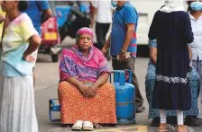  ?? AP ?? An elderly woman waits outside a police station as she ■ demands cooking gas in Colombo, Sri Lanka, on Saturday.