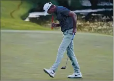  ?? JOHN LOCHER — THE ASSOCIATED PRESS ?? Martin Laird celebrates after sinking a putt on the 17th green in a playoff for his second victory at the Shriners Hospitals for Children Open in Las Vegas.