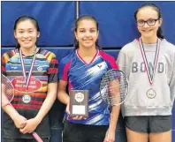  ?? SUBMITTED ?? Karla McCallum, centre, downed Ruiwen Zhu, left, 2-1 (16-21, 21-16, 21-19) in the under-19 women’s final at the recent Badminton P.E.I. under-15 and under-19 provincial­s in Cornwall. Hayden Ford, right, won the consolatio­n.