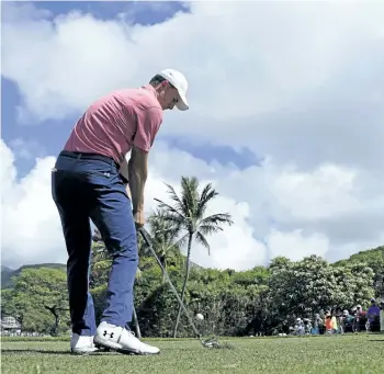 ?? MARCO GARCIA/THE ASSOCIATED PRESS ?? Jordan Spieth drives off the seventh tee during the first round of the Sony Open on Thursday in Honolulu, Hawaii.