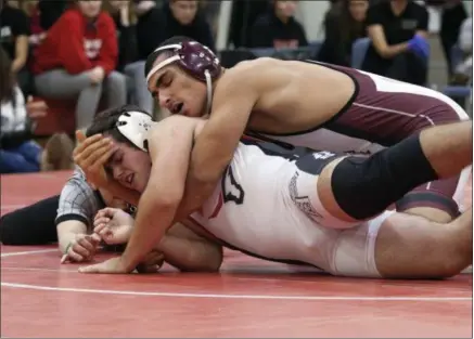  ?? JEN FORBUS — FOR THE MORNING JOURNAL ?? Rocky River’s Mahdi Salti has a firm grasp on Lutheran West’s Nate Knudson during their 220-pound bout on Dec. 10. Salti won by pin.