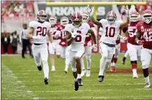  ?? MICHAEL WOODS — THE ASSOCIATED PRESS ?? Alabama’s DeVonta Smith (6) returns a punt for a touchdown against Arkansas on Saturday in Fayettevil­le, Ark.