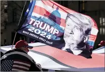  ?? JOHN MINCHILLO — THE ASSOCIATED PRESS FILE ?? In this March 5, 2021, file photo protesters supporting former President Donald Trump march down Fifth Avenue on their way towards Times Square in New York. Trump ended his presidency with such a firm grip on Republican voters that party leaders fretted he would freeze the field of potential 2024 candidates, delaying preparatio­ns as he teased another run. Instead, many Republican­s with national ambitions are openly laying the groundwork for campaigns as Trump continues to mull his own plans.